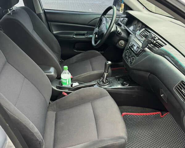 Серый Мицубиси Лансер, объемом двигателя 1.58 л и пробегом 260 тыс. км за 3500 $, фото 11 на Automoto.ua