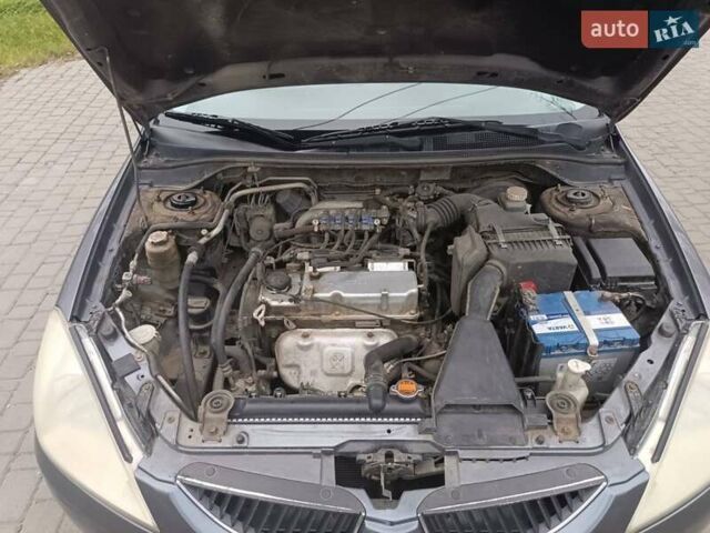 Сірий Міцубісі Lancer, об'ємом двигуна 1.58 л та пробігом 238 тис. км за 5500 $, фото 10 на Automoto.ua