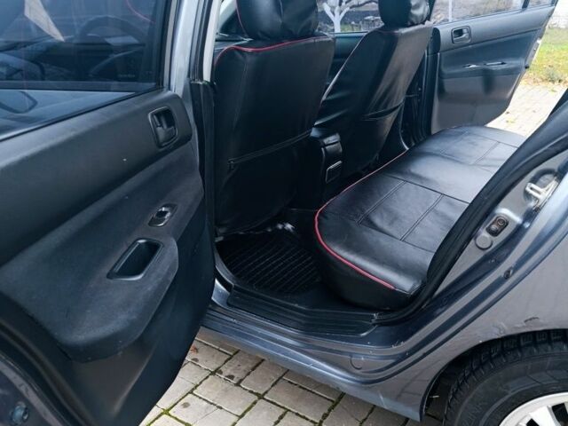 Серый Мицубиси Лансер, объемом двигателя 1.6 л и пробегом 100 тыс. км за 3500 $, фото 7 на Automoto.ua