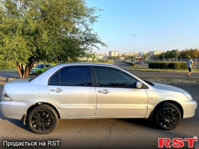 Сірий Міцубісі Lancer, об'ємом двигуна 1.6 л та пробігом 282 тис. км за 4100 $, фото 6 на Automoto.ua