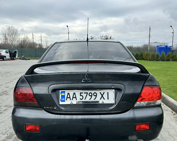 Серый Мицубиси Лансер, объемом двигателя 1.58 л и пробегом 300 тыс. км за 3500 $, фото 2 на Automoto.ua