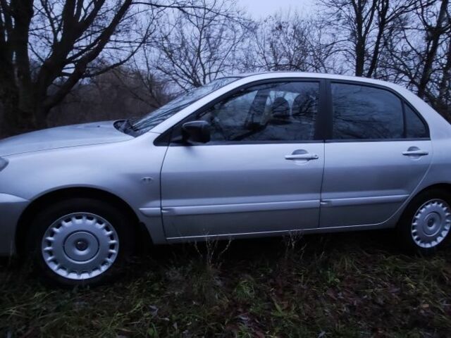 Серый Мицубиси Лансер, объемом двигателя 1.6 л и пробегом 235 тыс. км за 2850 $, фото 7 на Automoto.ua