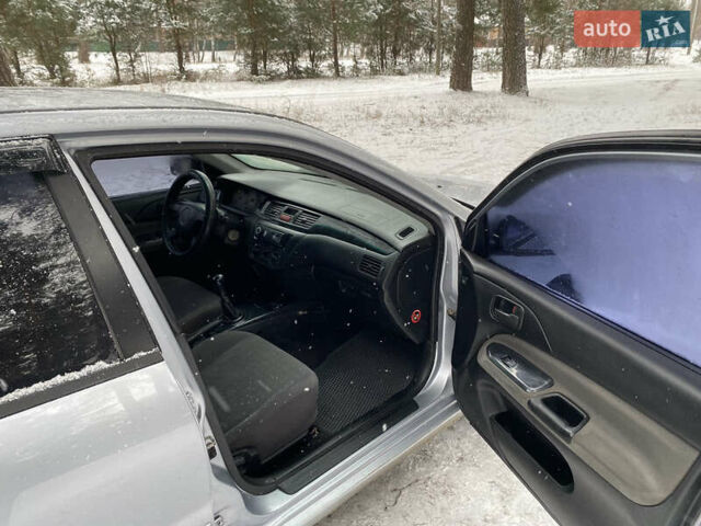 Серый Мицубиси Лансер, объемом двигателя 1.58 л и пробегом 225 тыс. км за 3950 $, фото 14 на Automoto.ua