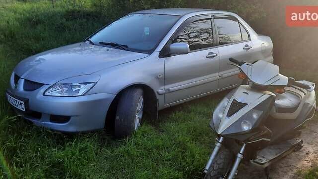 Сірий Міцубісі Lancer, об'ємом двигуна 1.58 л та пробігом 250 тис. км за 5000 $, фото 3 на Automoto.ua