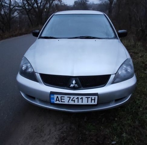 Серый Мицубиси Лансер, объемом двигателя 1.6 л и пробегом 235 тыс. км за 2850 $, фото 17 на Automoto.ua