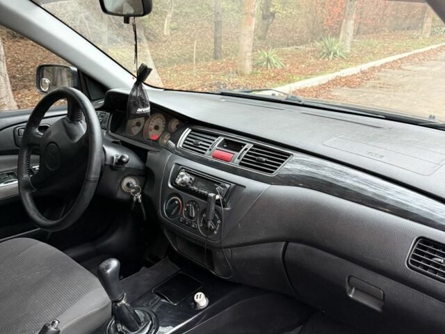 Сірий Міцубісі Lancer, об'ємом двигуна 1.6 л та пробігом 230 тис. км за 2799 $, фото 21 на Automoto.ua