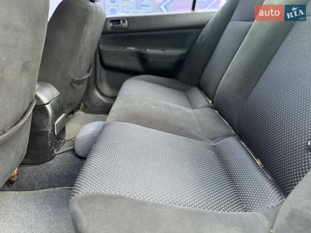 Сірий Міцубісі Lancer, об'ємом двигуна 1.58 л та пробігом 188 тис. км за 3799 $, фото 8 на Automoto.ua