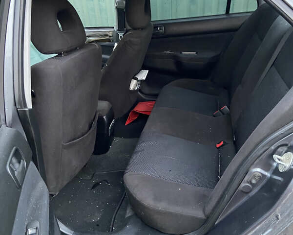 Сірий Міцубісі Lancer, об'ємом двигуна 1.58 л та пробігом 230 тис. км за 1400 $, фото 8 на Automoto.ua