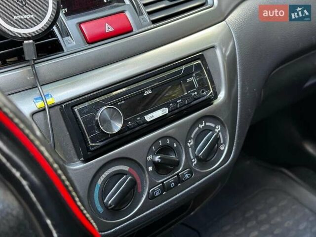 Серый Мицубиси Лансер, объемом двигателя 1.6 л и пробегом 196 тыс. км за 4490 $, фото 19 на Automoto.ua