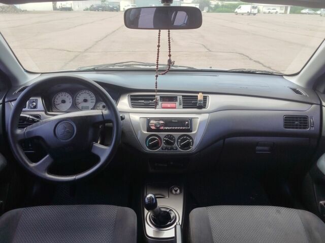 Серый Мицубиси Лансер, объемом двигателя 1.6 л и пробегом 250 тыс. км за 3600 $, фото 22 на Automoto.ua