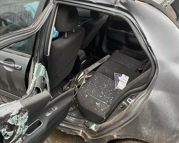 Сірий Міцубісі Lancer, об'ємом двигуна 1.58 л та пробігом 97 тис. км за 2000 $, фото 8 на Automoto.ua