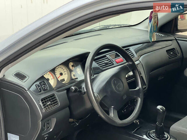 Сірий Міцубісі Lancer, об'ємом двигуна 1.6 л та пробігом 310 тис. км за 3350 $, фото 23 на Automoto.ua