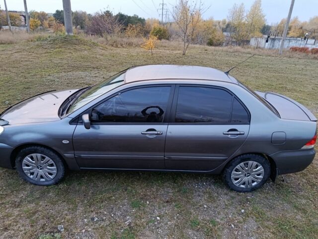 Міцубісі Lancer 2005 у Кам'янське (Дніпродзержинськ) на Automoto.ua Сірий Міцубісі Lancer, об'ємом двигуна 1.6 л та пробігом 220 тис. км за 4100 $, фото 4 на Automoto.ua
