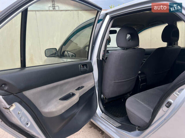 Сірий Міцубісі Lancer, об'ємом двигуна 1.6 л та пробігом 310 тис. км за 3350 $, фото 31 на Automoto.ua