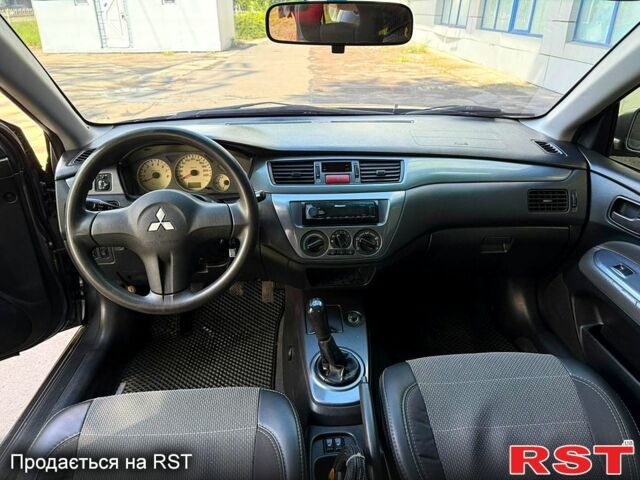 Серый Мицубиси Лансер, объемом двигателя 1.6 л и пробегом 300 тыс. км за 3850 $, фото 12 на Automoto.ua