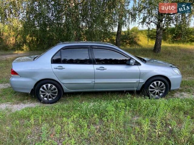 Сірий Міцубісі Lancer, об'ємом двигуна 1.58 л та пробігом 130 тис. км за 4600 $, фото 5 на Automoto.ua