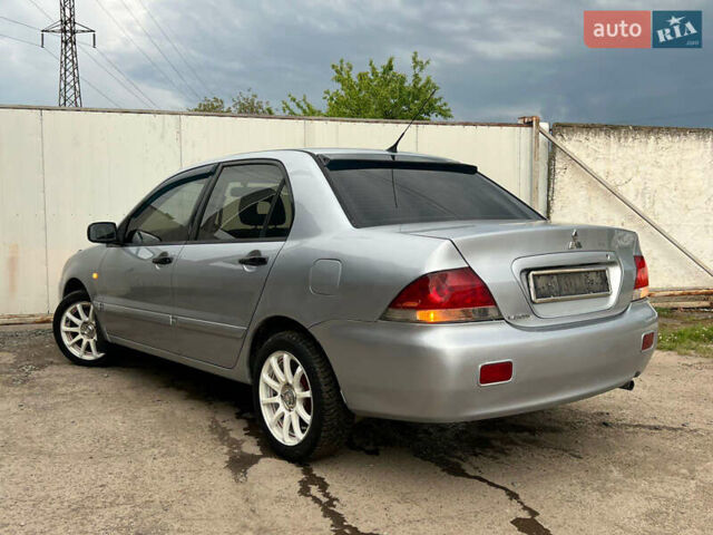 Сірий Міцубісі Lancer, об'ємом двигуна 1.6 л та пробігом 310 тис. км за 3350 $, фото 15 на Automoto.ua