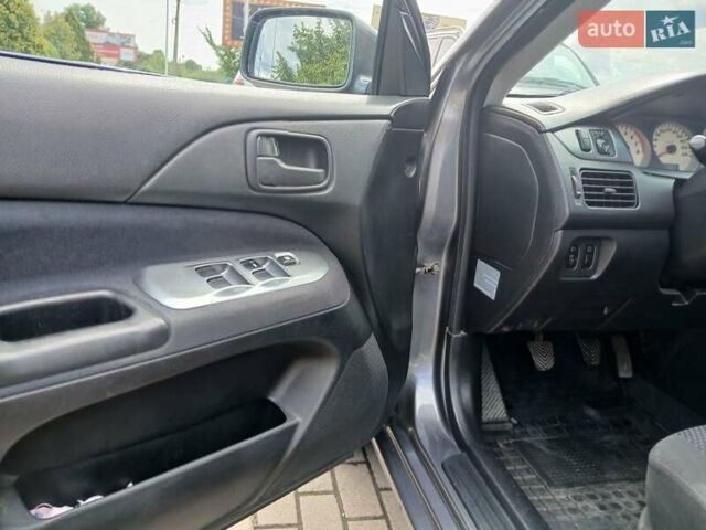 Сірий Міцубісі Lancer, об'ємом двигуна 1.58 л та пробігом 200 тис. км за 4000 $, фото 12 на Automoto.ua