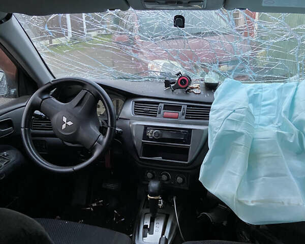 Сірий Міцубісі Lancer, об'ємом двигуна 1.58 л та пробігом 230 тис. км за 1400 $, фото 6 на Automoto.ua