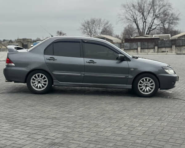 Серый Мицубиси Лансер, объемом двигателя 1.58 л и пробегом 237 тыс. км за 2999 $, фото 5 на Automoto.ua