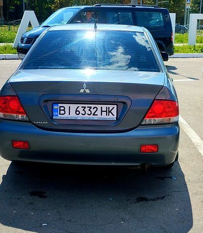 Сірий Міцубісі Lancer, об'ємом двигуна 1.6 л та пробігом 214 тис. км за 3800 $, фото 1 на Automoto.ua