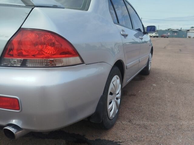 Серый Мицубиси Лансер, объемом двигателя 1.6 л и пробегом 250 тыс. км за 3600 $, фото 16 на Automoto.ua