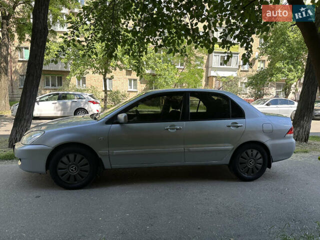 Сірий Міцубісі Lancer, об'ємом двигуна 1.58 л та пробігом 290 тис. км за 3500 $, фото 7 на Automoto.ua