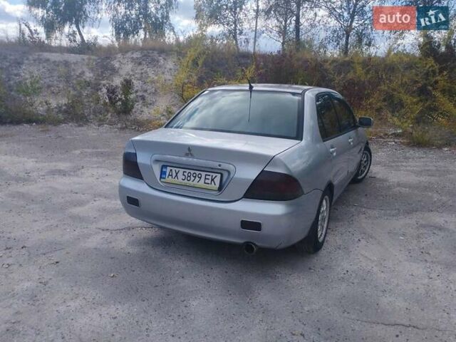 Сірий Міцубісі Lancer, об'ємом двигуна 1.6 л та пробігом 244 тис. км за 3300 $, фото 3 на Automoto.ua