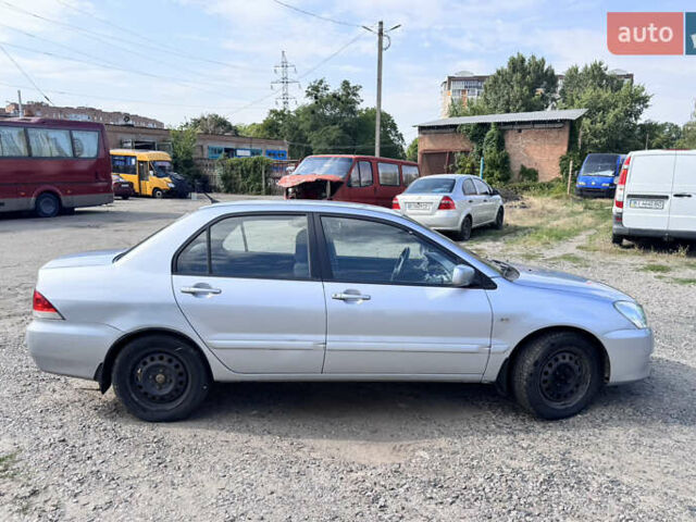 Сірий Міцубісі Lancer, об'ємом двигуна 1.58 л та пробігом 292 тис. км за 5000 $, фото 13 на Automoto.ua