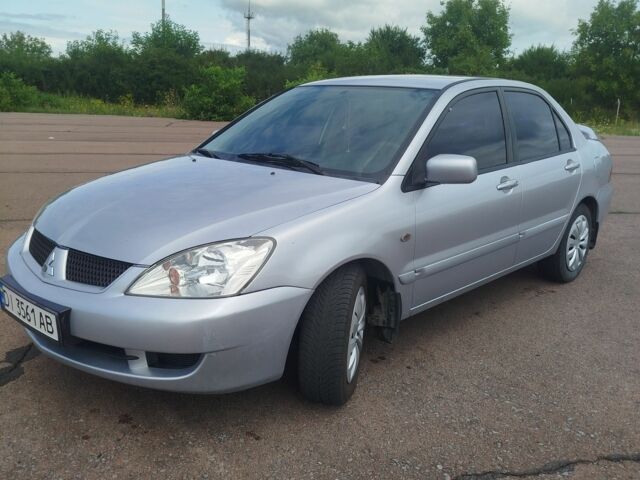 Серый Мицубиси Лансер, объемом двигателя 1.6 л и пробегом 250 тыс. км за 3600 $, фото 9 на Automoto.ua