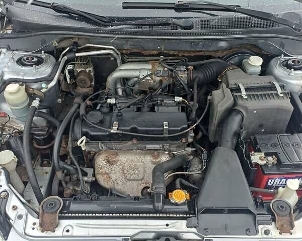 Сірий Міцубісі Lancer, об'ємом двигуна 1.58 л та пробігом 260 тис. км за 2800 $, фото 8 на Automoto.ua