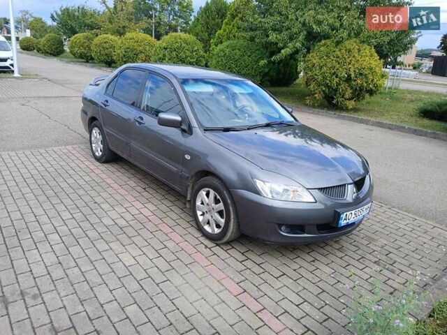 Сірий Міцубісі Lancer, об'ємом двигуна 1.58 л та пробігом 200 тис. км за 4000 $, фото 10 на Automoto.ua