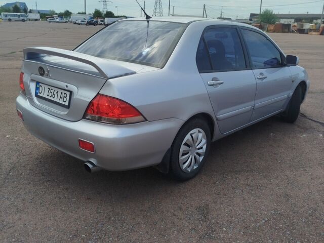 Серый Мицубиси Лансер, объемом двигателя 1.6 л и пробегом 250 тыс. км за 3600 $, фото 5 на Automoto.ua