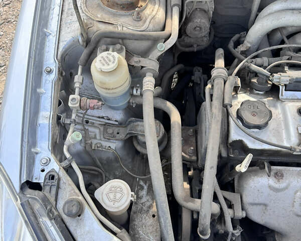 Сірий Міцубісі Lancer, об'ємом двигуна 1.58 л та пробігом 292 тис. км за 5000 $, фото 22 на Automoto.ua