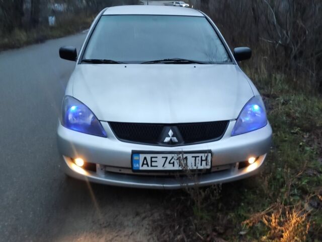 Серый Мицубиси Лансер, объемом двигателя 1.6 л и пробегом 235 тыс. км за 2850 $, фото 1 на Automoto.ua
