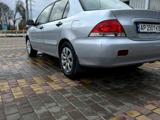 Сірий Міцубісі Lancer, об'ємом двигуна 1.6 л та пробігом 236 тис. км за 3800 $, фото 3 на Automoto.ua
