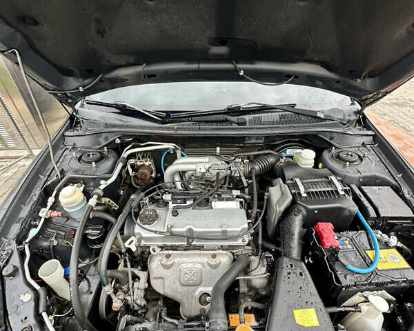 Серый Мицубиси Лансер, объемом двигателя 1.58 л и пробегом 300 тыс. км за 3500 $, фото 3 на Automoto.ua