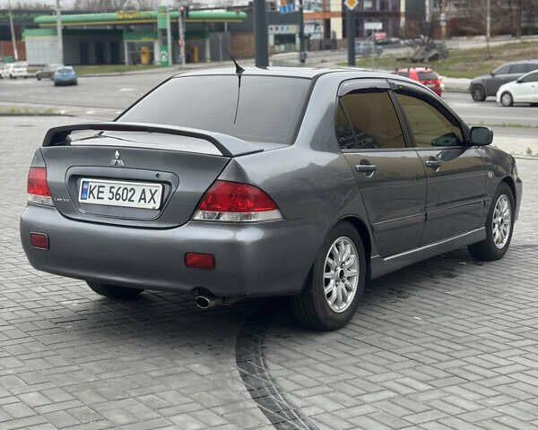 Серый Мицубиси Лансер, объемом двигателя 1.58 л и пробегом 237 тыс. км за 2999 $, фото 4 на Automoto.ua