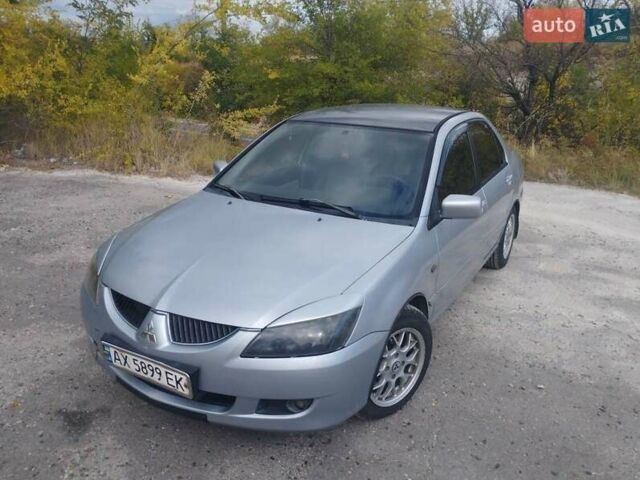 Сірий Міцубісі Lancer, об'ємом двигуна 1.6 л та пробігом 244 тис. км за 3300 $, фото 12 на Automoto.ua