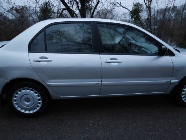 Серый Мицубиси Лансер, объемом двигателя 1.6 л и пробегом 235 тыс. км за 2850 $, фото 15 на Automoto.ua