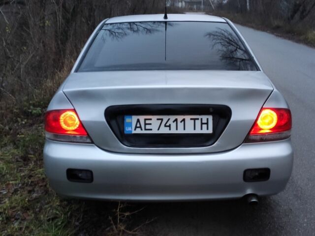 Серый Мицубиси Лансер, объемом двигателя 1.6 л и пробегом 235 тыс. км за 2850 $, фото 5 на Automoto.ua