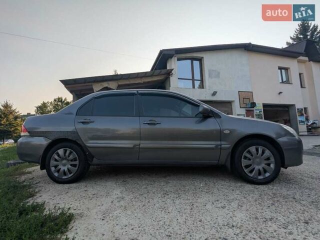 Сірий Міцубісі Lancer, об'ємом двигуна 1.58 л та пробігом 384 тис. км за 2500 $, фото 4 на Automoto.ua
