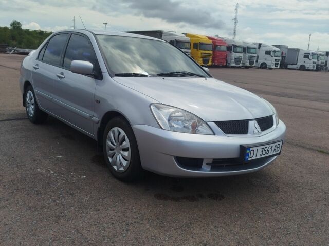 Серый Мицубиси Лансер, объемом двигателя 1.6 л и пробегом 250 тыс. км за 3600 $, фото 13 на Automoto.ua