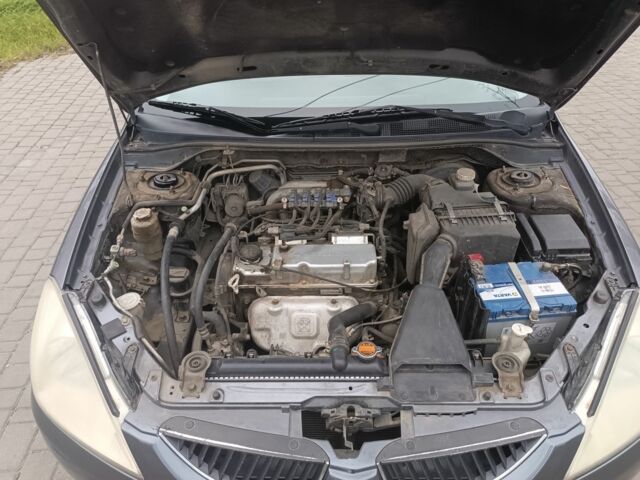 Серый Мицубиси Лансер, объемом двигателя 1.6 л и пробегом 242 тыс. км за 4600 $, фото 5 на Automoto.ua