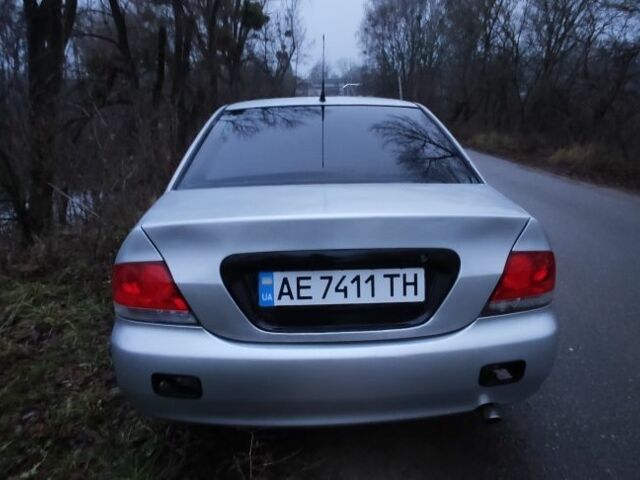 Серый Мицубиси Лансер, объемом двигателя 1.6 л и пробегом 235 тыс. км за 2850 $, фото 10 на Automoto.ua