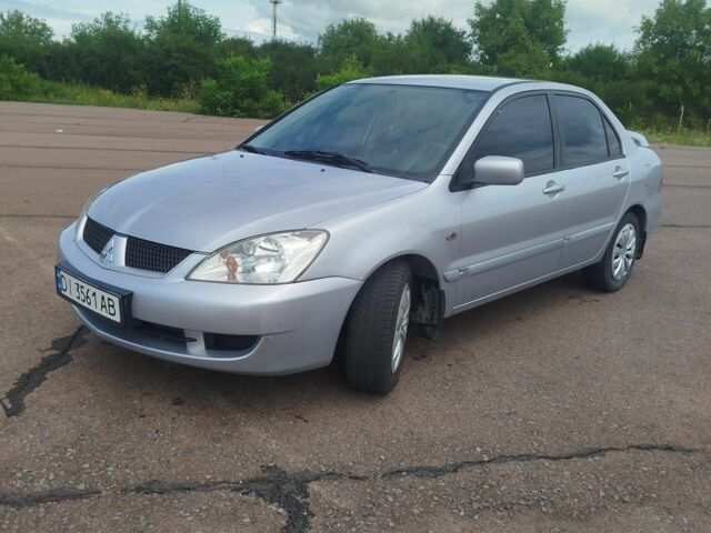 Серый Мицубиси Лансер, объемом двигателя 1.6 л и пробегом 250 тыс. км за 3600 $, фото 2 на Automoto.ua