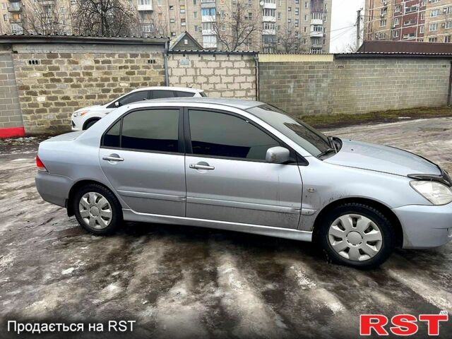 Сірий Міцубісі Lancer, об'ємом двигуна 1.6 л та пробігом 199 тис. км за 4399 $, фото 4 на Automoto.ua