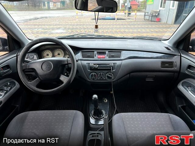 Сірий Міцубісі Lancer, об'ємом двигуна 1.6 л та пробігом 236 тис. км за 3800 $, фото 8 на Automoto.ua
