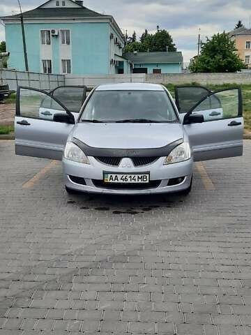 Серый Мицубиси Лансер, объемом двигателя 1.6 л и пробегом 277 тыс. км за 3500 $, фото 6 на Automoto.ua