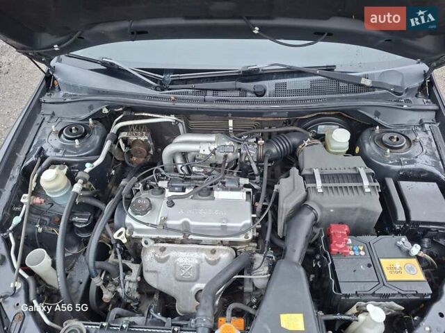 Серый Мицубиси Лансер, объемом двигателя 1.6 л и пробегом 305 тыс. км за 4000 $, фото 8 на Automoto.ua